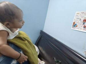 Baby Eeshaan looking carefully at affirmation cards pasted on the wall at home.